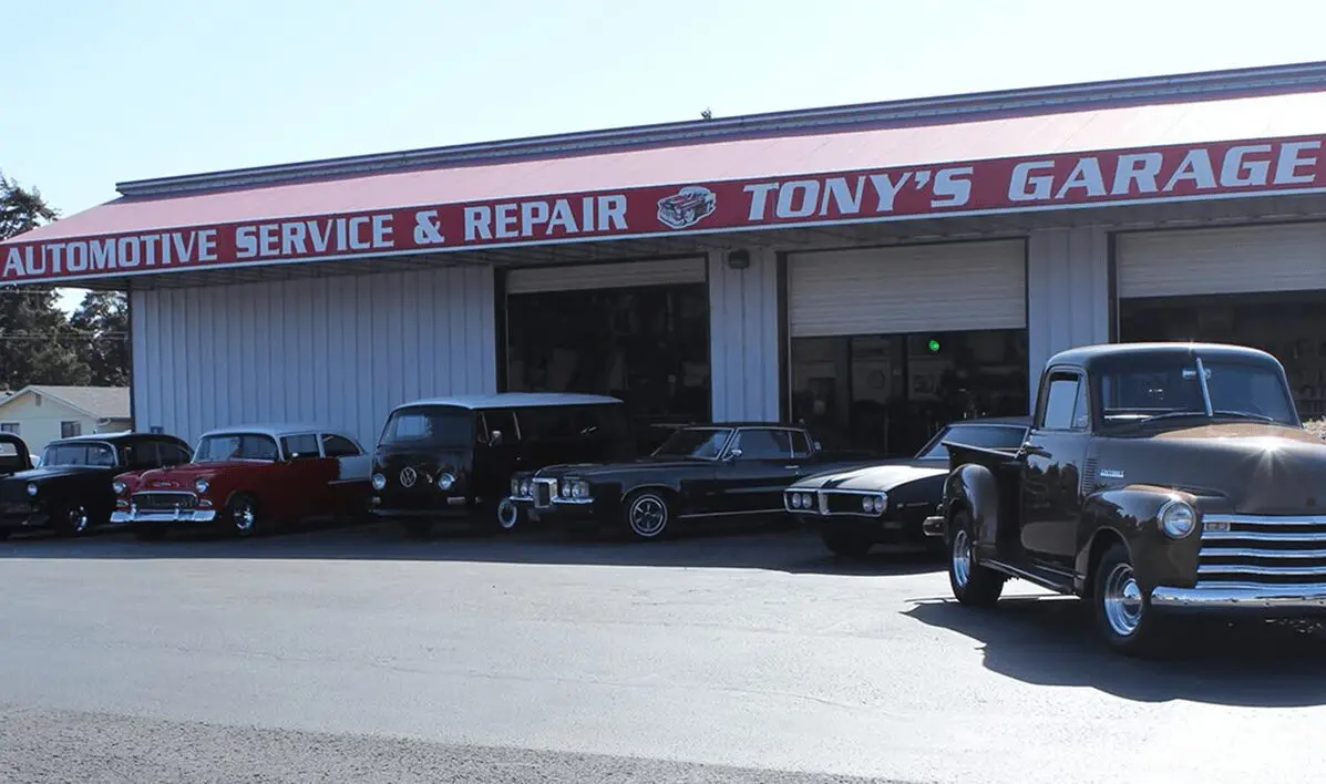 Vintage cars parked outside Tony's Garage.