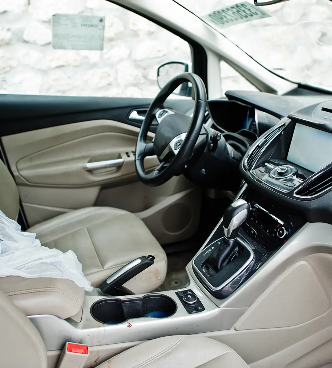 Car interior with beige leather seats.